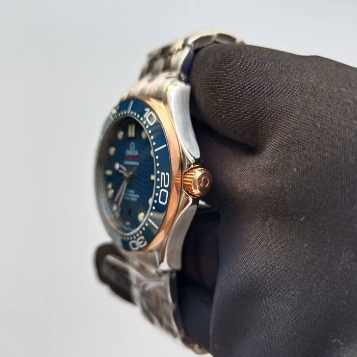 Omega Seamaster 300m on wrist | 42MM Blue Dial Rose Gold | Two Tone Bracelet Watch - Image 4