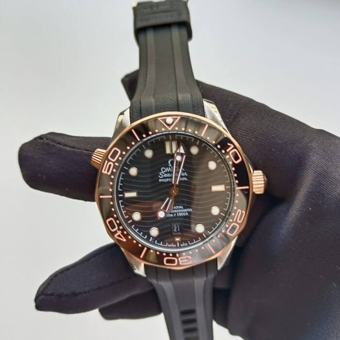Omega Seamaster black rubber strap 300m Stainless Steel Sedna Gold Co Axial Master Chronometer Black Dial 42mm